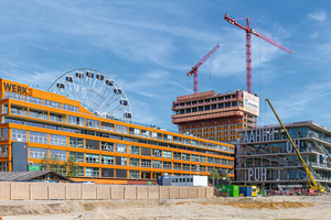  Das Werksviertel am Münchner Ostbahnhof entwickelt sich zum spannenden Architekturschauplatz, dominiert vom neuen, 86&nbsp;m hohen Werk 4. 