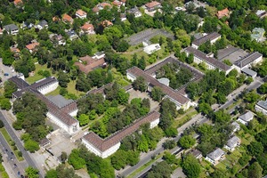  The Metropolitan Gardens aus der Luft: Auf dem historischen Gelände des ehemaligen US-Hauptquartiers in Berlin Dahlem entstand mit enormem Aufwand eine außergewöhnliche Wohn- und Parkanlage. 